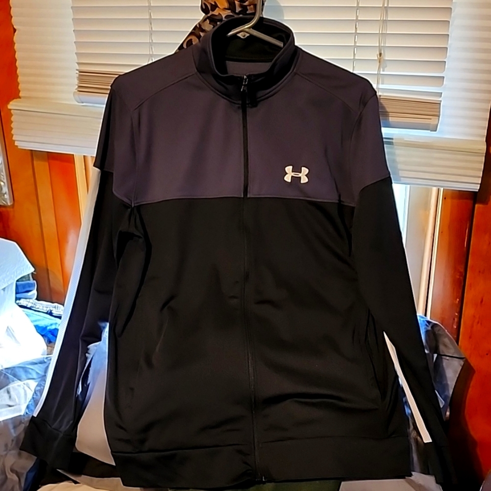 Mens Medium black, gray, and white UnderArmour full-zippered track jacket.